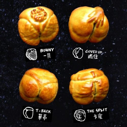 A display of four award-winning buns on a black surface.