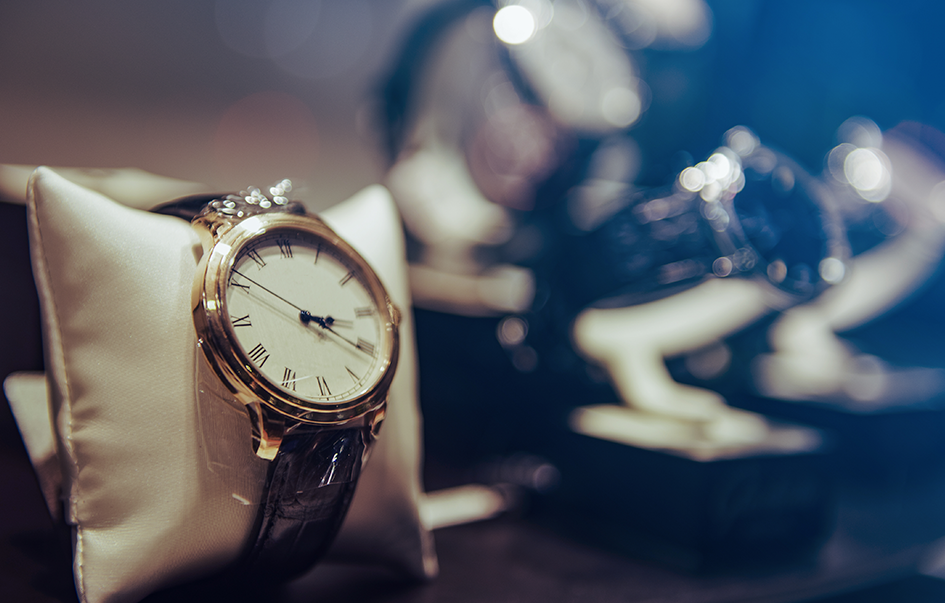 A white pillow featuring an award-winning watch.