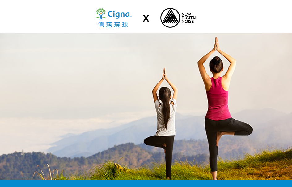 Two award-winning women practicing yoga on top of a mountain.