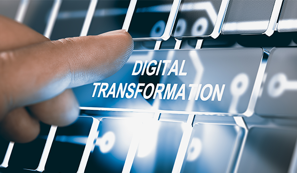 A person achieving award-winning digital transformation through pressing the keyboard.