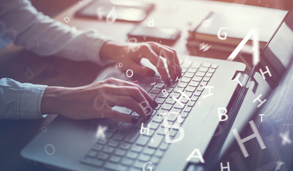 A person engaged in digital marketing typing on a laptop keyboard in award-winning Hong Kong.