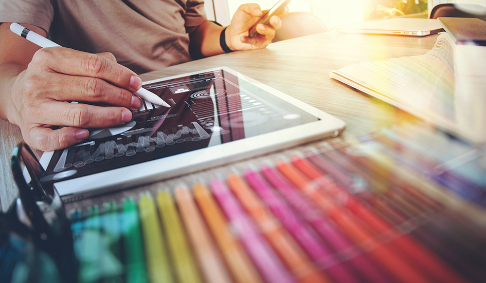 An SEO expert working on a tablet with digital marketing tools.