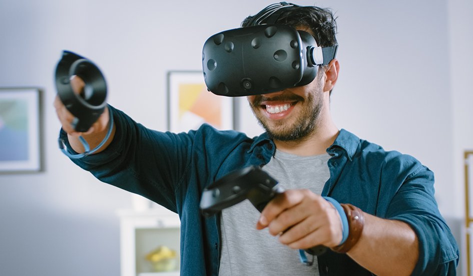 A man is playing an award-winning game using a VR headset in Hong Kong.