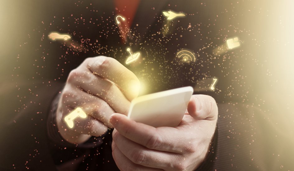 A man in a suit is holding an award winning smart phone.