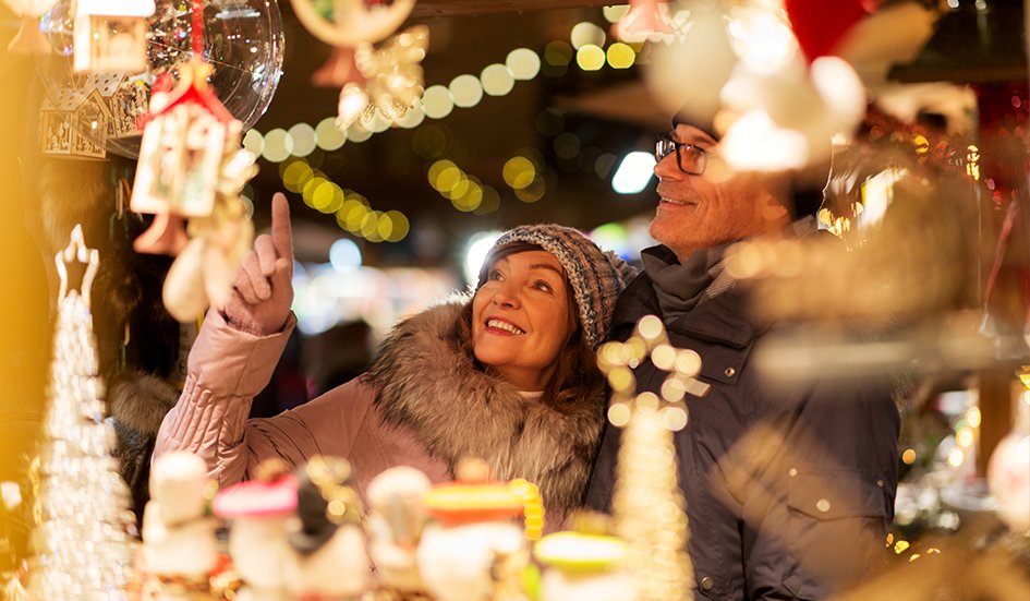 A couple exploring award-winning Christmas decorations at a market in Hong Kong.